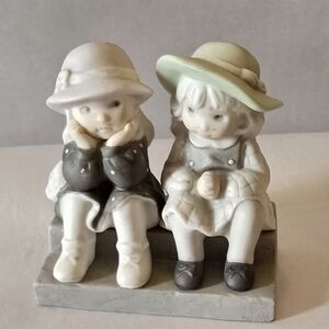 Charming Porcelain Figurine of Two Children